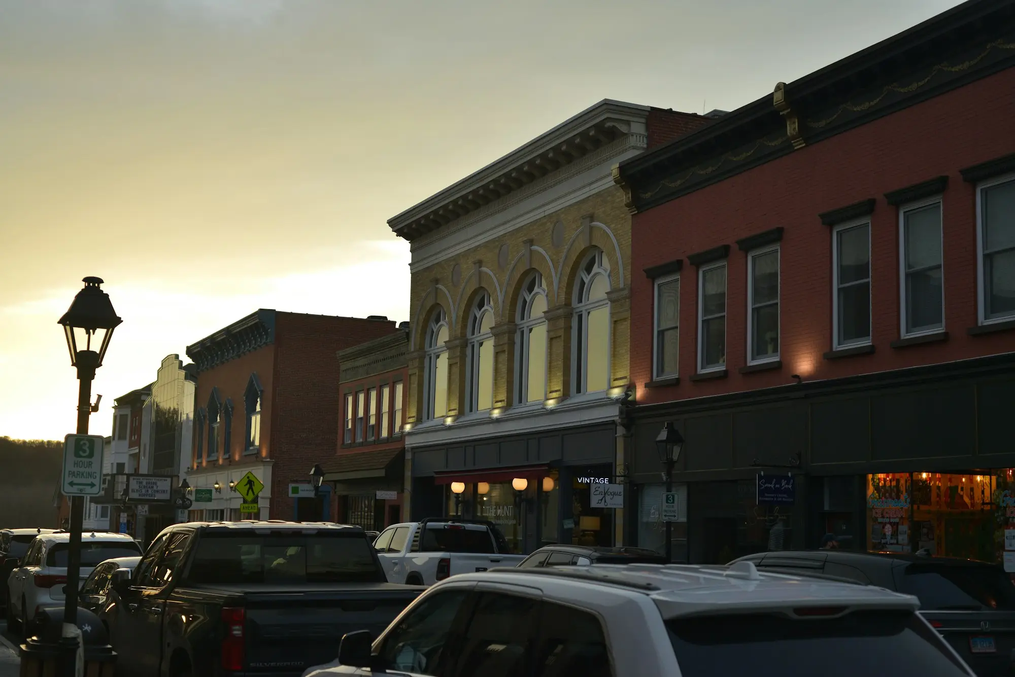 Street of historic commercial buildings at dusk
