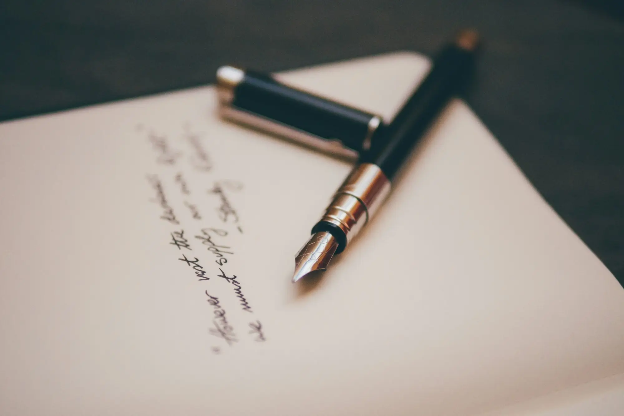 Black and silver fountain pen resting on paperwork